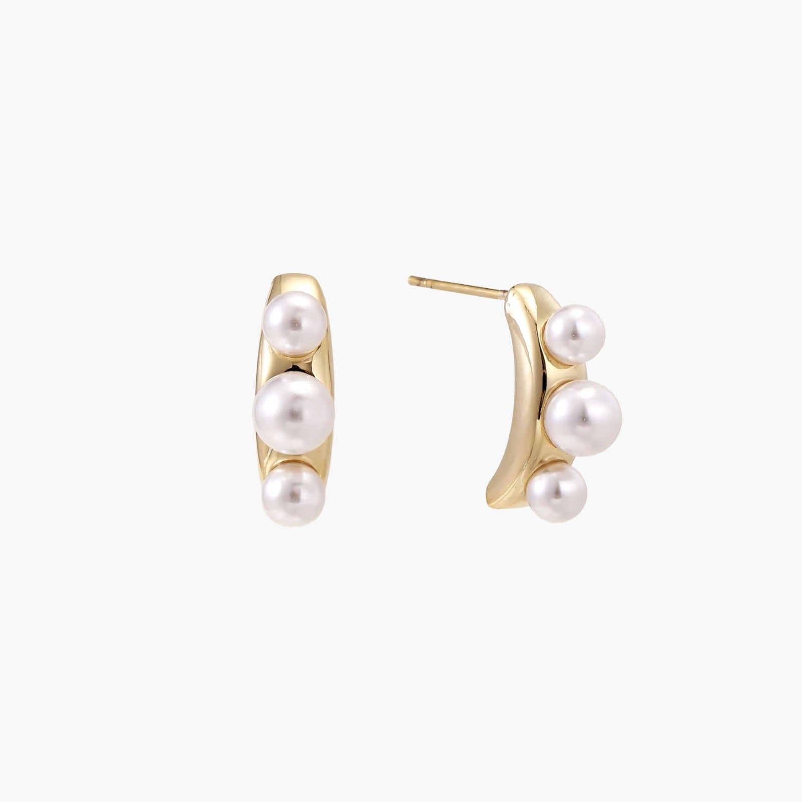 14K gold-plated curved stud earrings with three white freshwater pearls aligned vertically on cream background